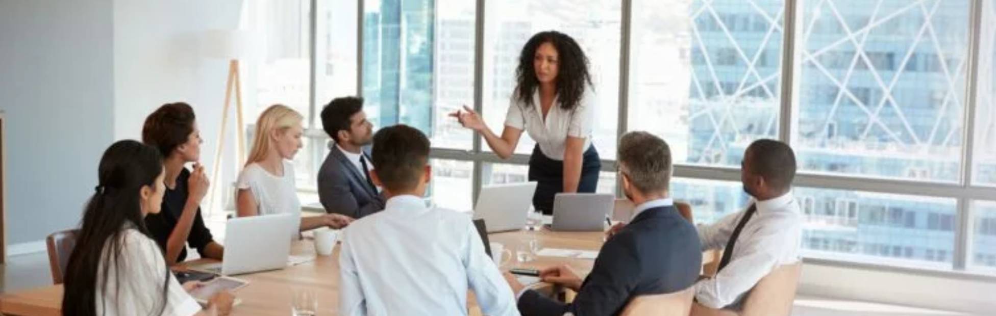 Lady leading a meeting with coworkers
