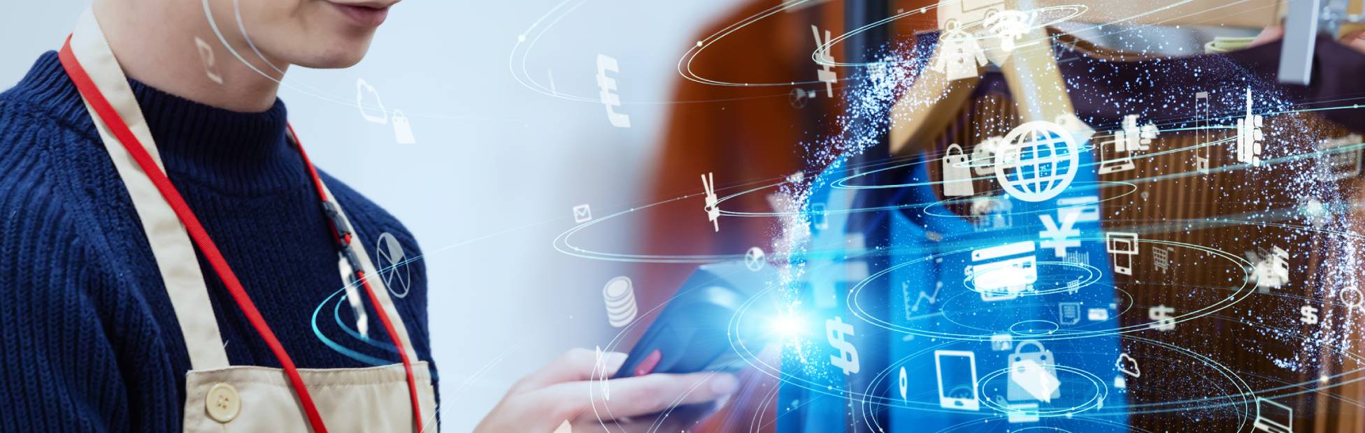 A business owner looking at a phone with e-commerce icons swirling around it