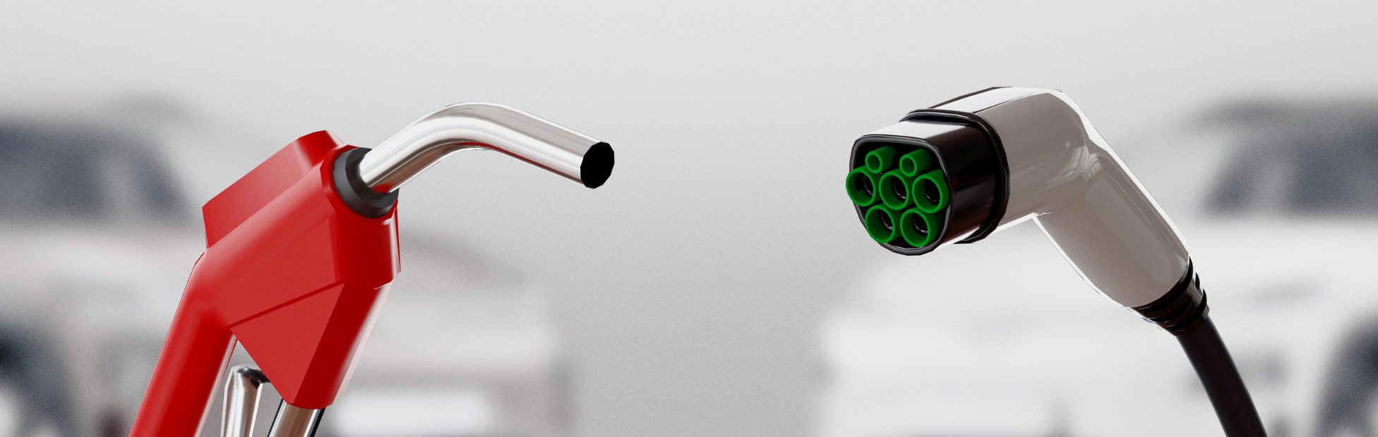 Une conduite d'essence rouge et un câble de recharge électrique vert